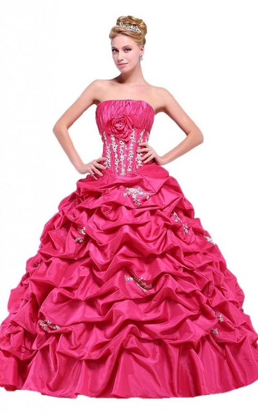 Strapless Ball Gown With Ruffles and Flower Detail